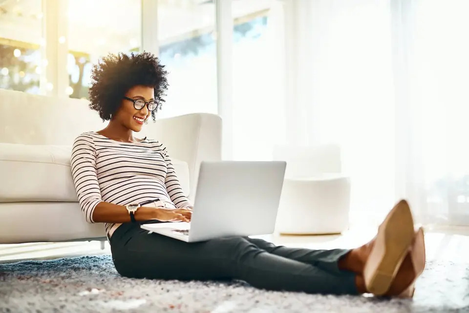 A woman browsing on a laptop