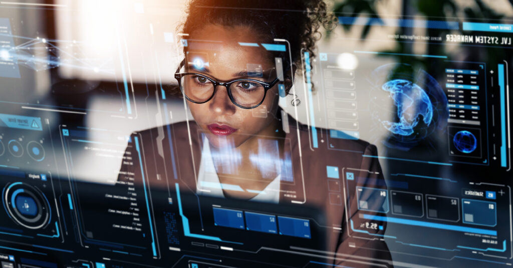 A woman works at her computer representing AI in L&D.